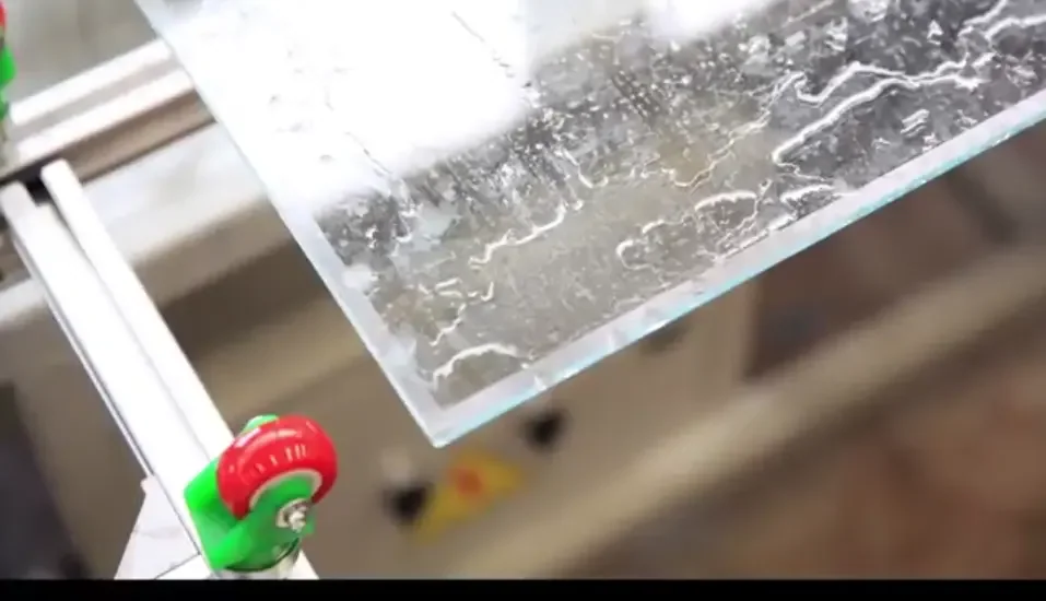 Low-E coated glass edge entering the coating removal process