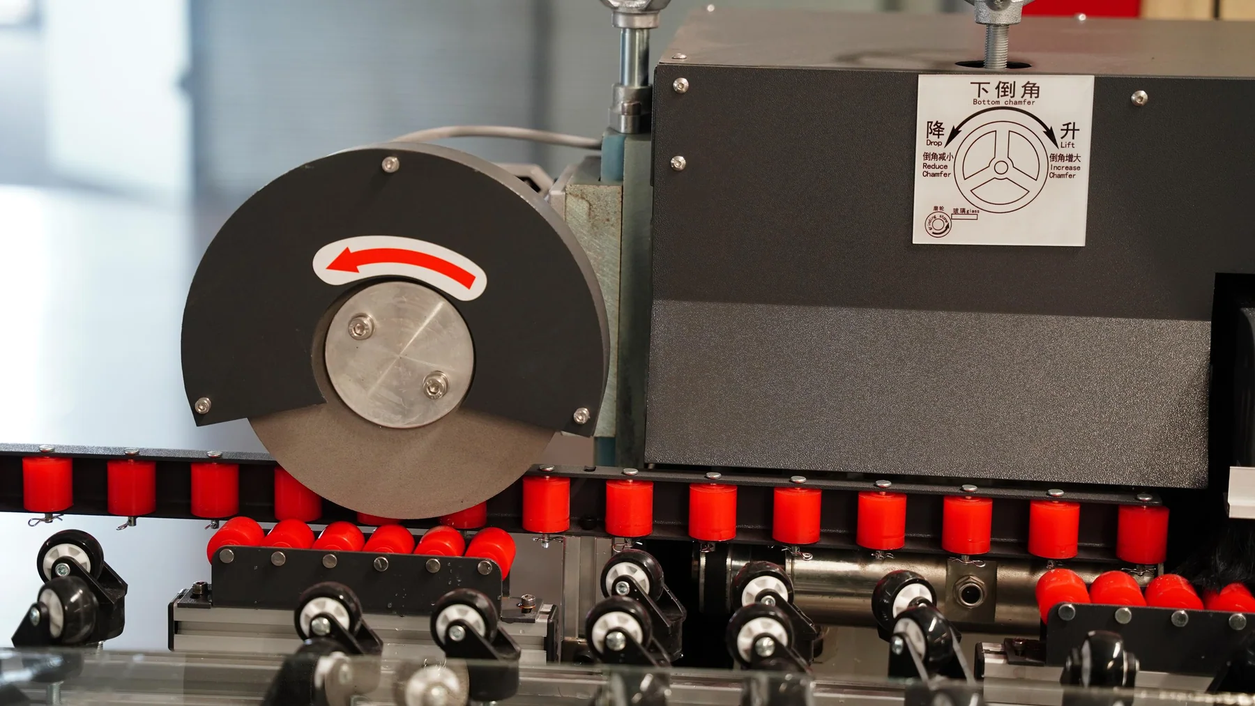 Low-E glass edge deletion machine wheel-height and chamfer adjustment assembly